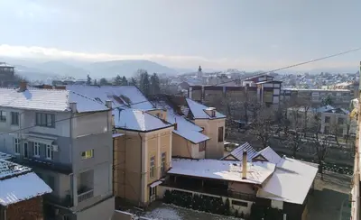 a city with snow covered roofs and buildings at Lela's home (Lelin dom) in Knjazevac.