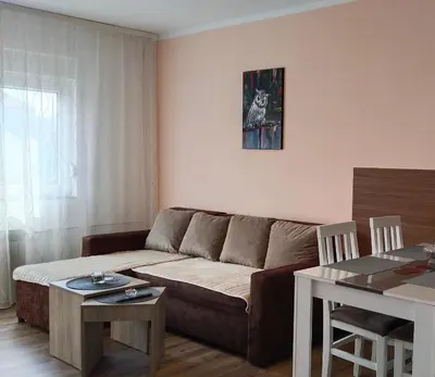 a living room with a couch and a table at Lela's home (Lelin dom) in Knjazevac.