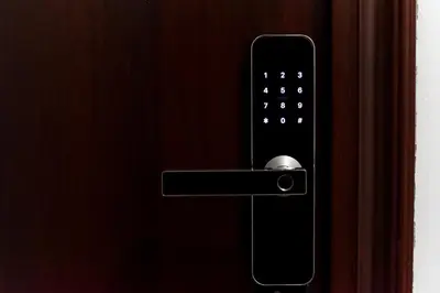 a close up of a remote control on a door at La Maison in Niš