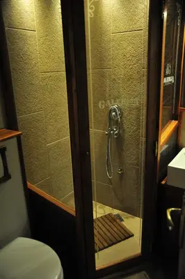 a shower in a bathroom with a toilet at B&B Galerija Two Rooms in Paraćin