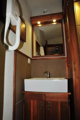 a bathroom with a sink and a mirror at B&B Galerija Two Rooms in Paraćin
