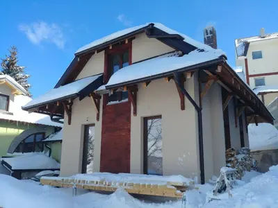 a house with snow on the roof at FlowHouse - cozy place for you. in Kopaonik