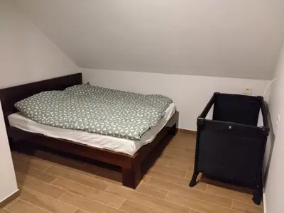 a small bedroom with a bed in a room at FlowHouse - cozy place for you. in Kopaonik
