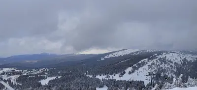 a view of a snowy mountain with a ski lift at Glečer Kop A11 FREE Parking Garage in Kopaonik