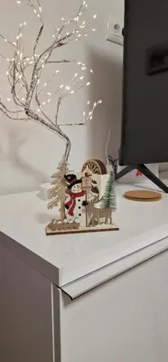a desk with a christmas decoration on a computer monitor at Glečer Kop A11 FREE Parking Garage in Kopaonik