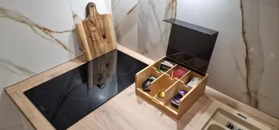 a small wooden box with wine bottles in it at Glečer Kop A11 FREE Parking Garage in Kopaonik