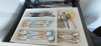 a drawer full of silver utensils and spoons at Glečer Kop A11 FREE Parking Garage in Kopaonik
