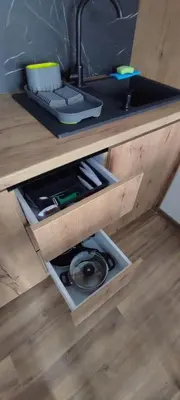 a drawer in a wooden desk with a computer keyboard at Apartment KopaLux in Kopaonik