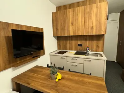a kitchen with a sink and a table with a banana at Studio Pablo Vila Bela Reka in Brzeće