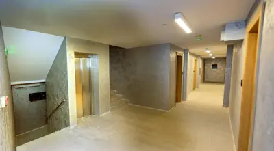 an empty hallway with stairs in a building at Studio Pablo Vila Bela Reka in Brzeće