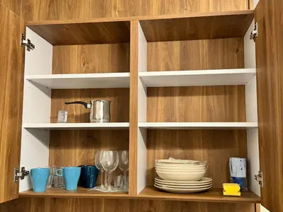 a cupboard with plates and dishes on it at Studio Joanna Vila Bela Reka in Brzeće