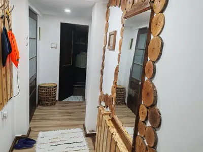 a hallway with a mirror on the wall at Vila Antić in Pirot