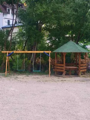 a playground with a gazebo and a swing at Brvnare Todorovic in Crni Vrh