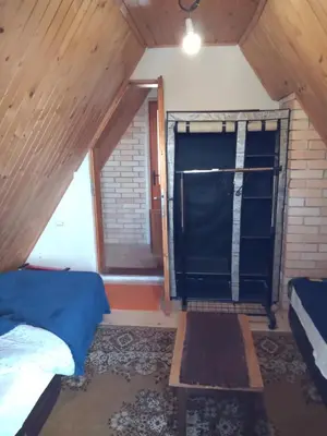 a room with two beds and a window at KopanikSkiRooms15e in Kopaonik