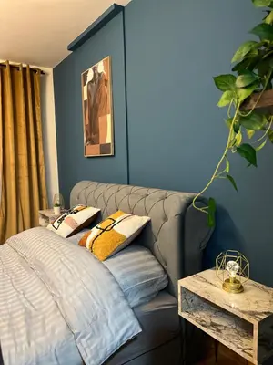 a living room with a couch and a table at LP Premium Studio in Niš
