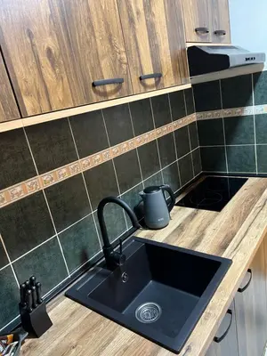 a kitchen with a sink and a counter top at LP Premium Studio in Niš