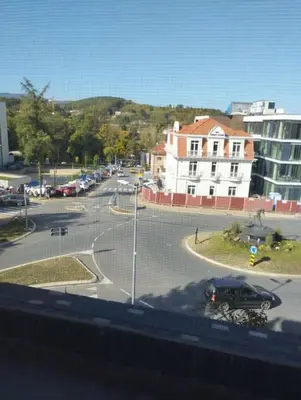 a view of a street with a parking lot at Apartman Slavica in Vrnjačka Banja