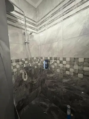 a bathroom with a shower with a glass door at Apartman Slavica in Vrnjačka Banja