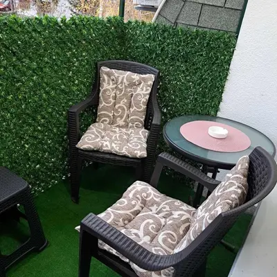 a patio with two chairs and a table and a table at Apartman Magic in Soko Banja