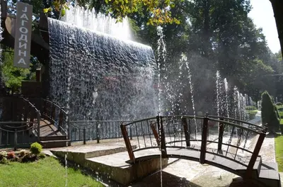 a water fountain with a bridge in front of it at Crnjanski Paun L in Jagodina