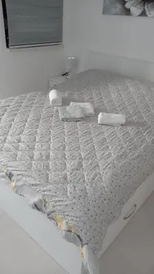 a mattress with two towels on it on a bed at Crnjanski Paun L in Jagodina
