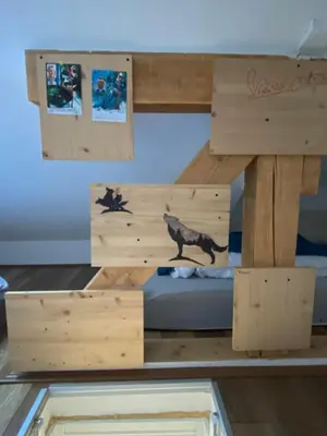a wooden bunk bed in a room with a window at LOVE apartman JeLEna in Brzeće