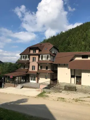 a large building on the side of a road at LOVE apartman JeLEna in Brzeće