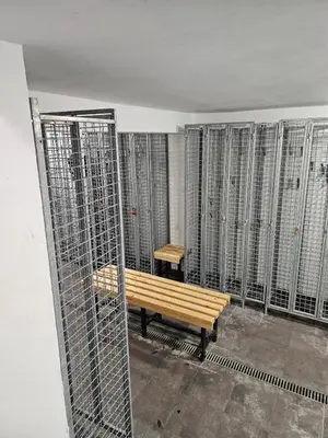 a bench in a room with a bunch of metal fences at Studio Leone Sunčana Planina in Kopaonik