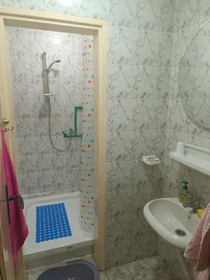a bathroom with a shower and a sink at Vila Jovana in Rogljevo