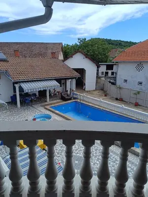 a view from the balcony of a house with a swimming pool at Vila Jovana in Rogljevo