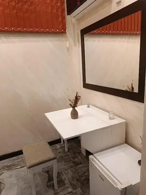 a bathroom with a white sink and a mirror at M Central Park in Niš