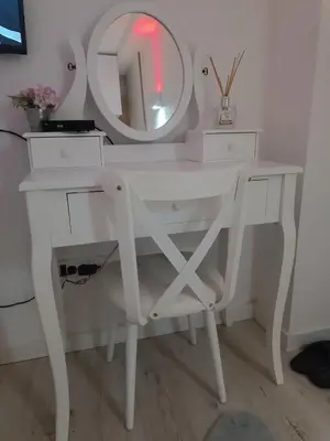 a white dressing table with a mirror and a stool at M Central Park in Niš