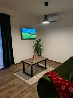 a living room with a couch and a coffee table at Vila Bosa - Stara planina in Crni Vrh