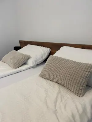 two beds sitting next to each other in a bedroom at Vila Bosa - Stara planina in Crni Vrh
