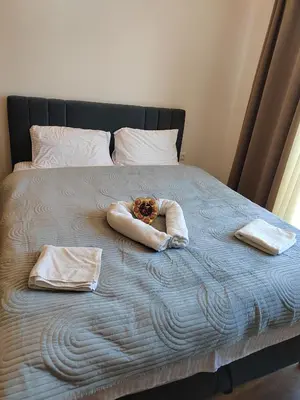 a bed with two towels and two baskets on it at President Kop Paxson in Kopaonik
