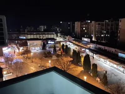 a view of a city at night at Apartman VUK in Pirot