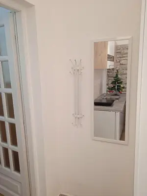 a kitchen with a mirror and a counter at APARTMANSKI SMEŠTAJ SOLARIS kod Aqua Parka Yuth Studio in Soko Banja