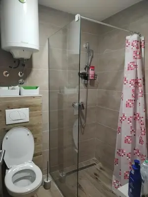 a shower stall with a toilet in a bathroom at N Lux 95 Milmari in Kopaonik