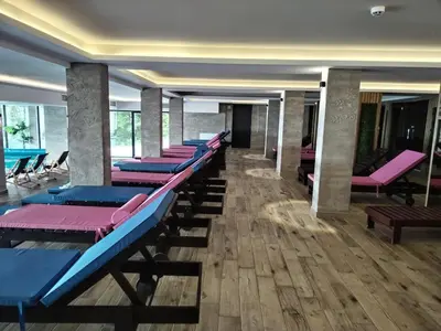 a row of chaise lounges in a room at N Lux 95 Milmari in Kopaonik