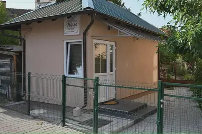 a small house with a fence in front of it at Golden Star Viktor in Zaječar