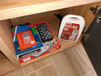 a first aid kit and a first aid box on a drawer at XL apartments, Residence Hill, Kopaonik in Kopaonik
