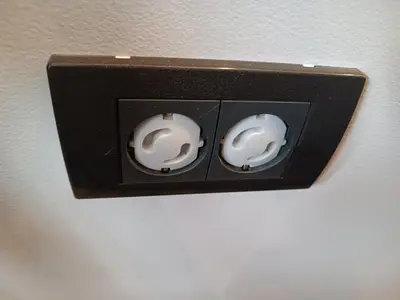 a switch with two white knobs on a wall at XL apartments, Residence Hill, Kopaonik in Kopaonik