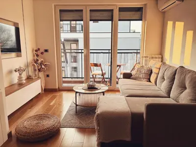 a living room with a couch and a table at N Apartment in Vrnjačka Banja