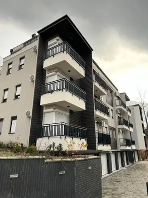a building with balconies on the side of it at N Apartment in Vrnjačka Banja