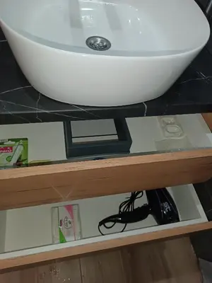 a sink sitting on a shelf under a sink at M&Alux Kopaonik in Cajetina