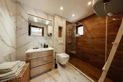 a bathroom with a toilet and a shower at Anja Sousza Apartment in Kopaonik