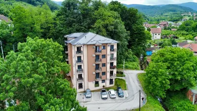 an apartment building in the middle of a city at Apartman Gorsky in Vrnjačka Banja