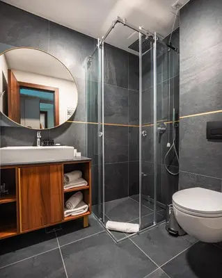 a bathroom with a shower and a sink at Hotel Kocka Vrnjačka Banja in Vrnjačka Banja
