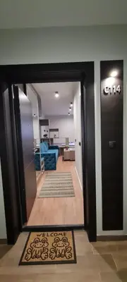 a hallway with a door leading to a living room at Apartman Snezni Vrh - Bela Reka, Brzece in Brzeće