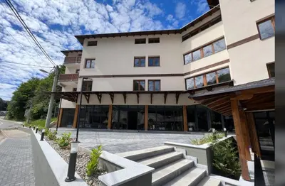 a building with a staircase in front of it at Apartman Snezni Vrh - Bela Reka, Brzece in Brzeće